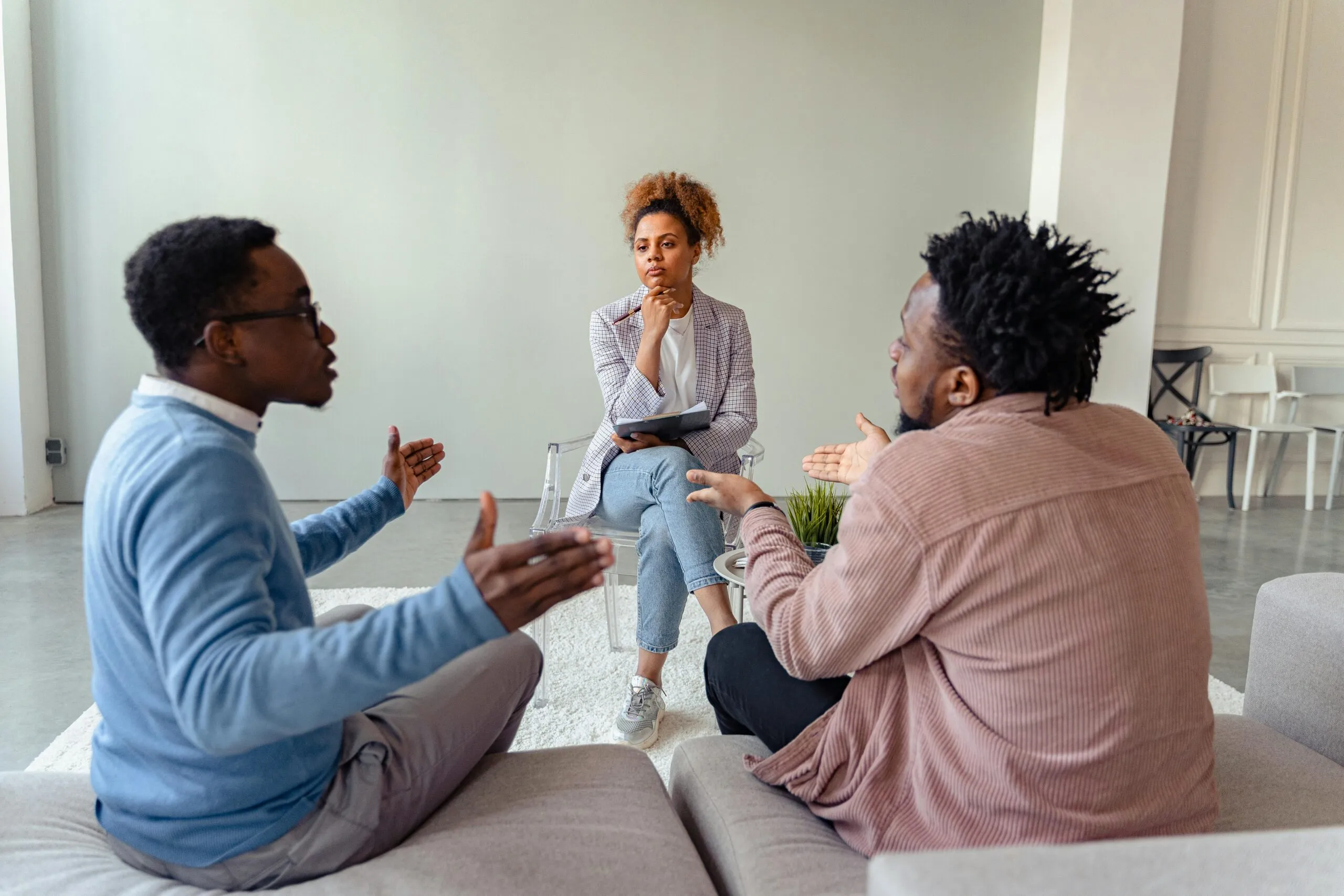 Couples therapy session with a therapist representing communication skills and the difference between understanding and agreeing