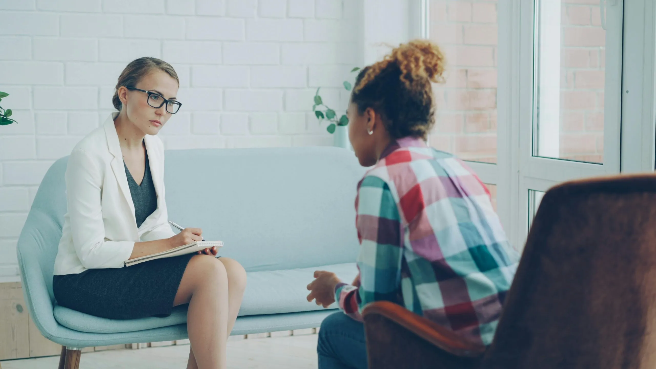 Therapist and client in conversation representing the importance of language and identity in pornography addiction recovery