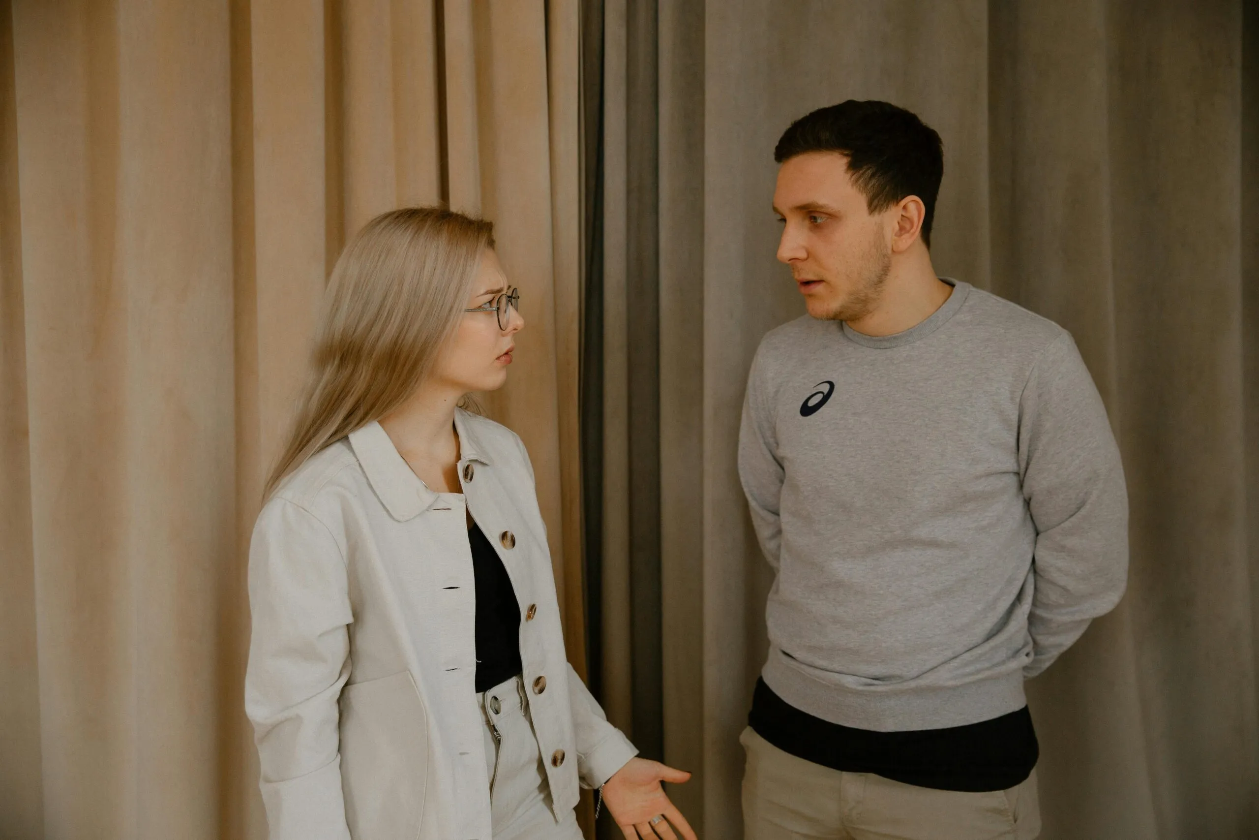 Couple having a thoughtful conversation representing open communication about sexual values and boundaries in relationships