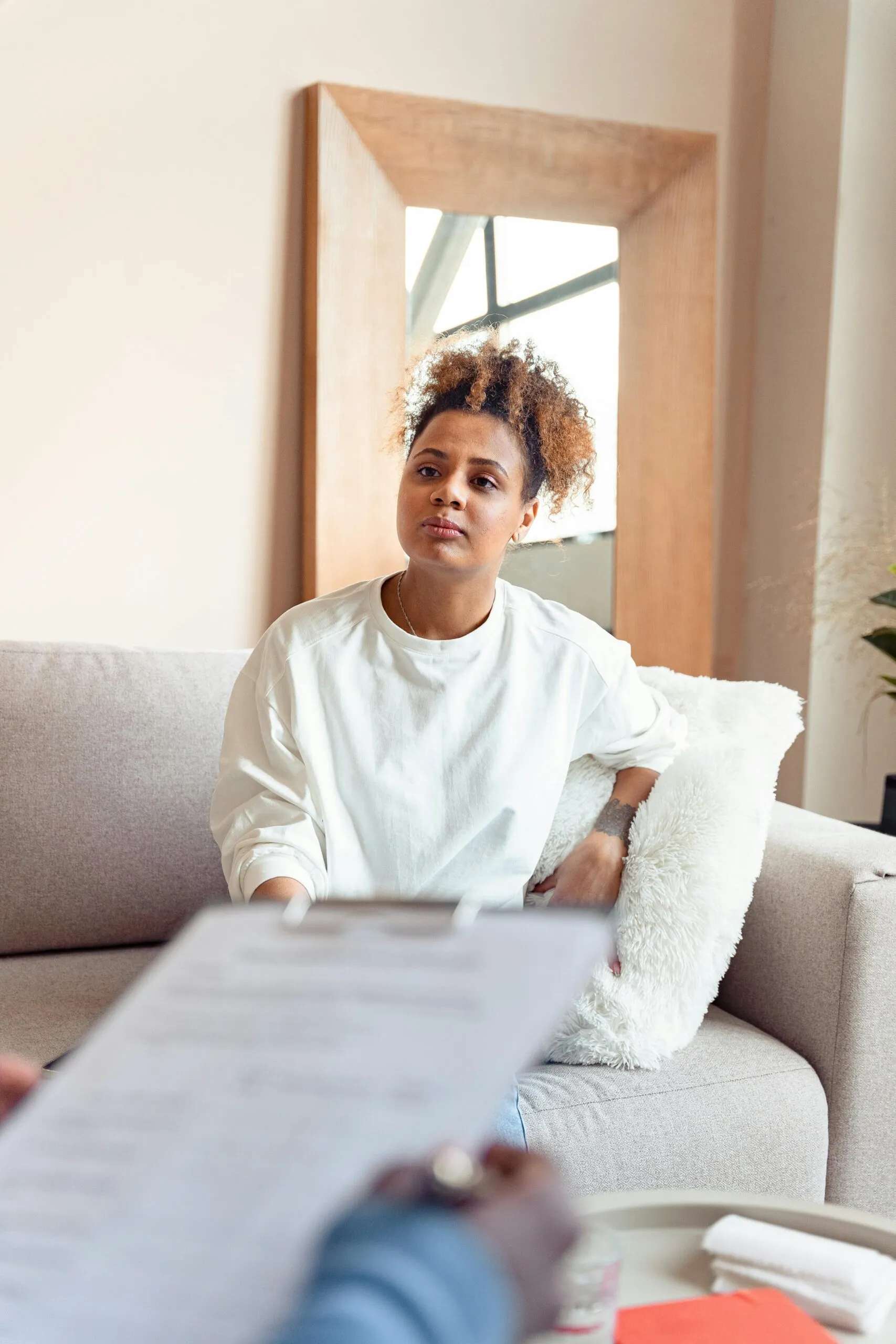 Person sitting with a therapist representing the EMDR therapy process for trauma healing in Utah