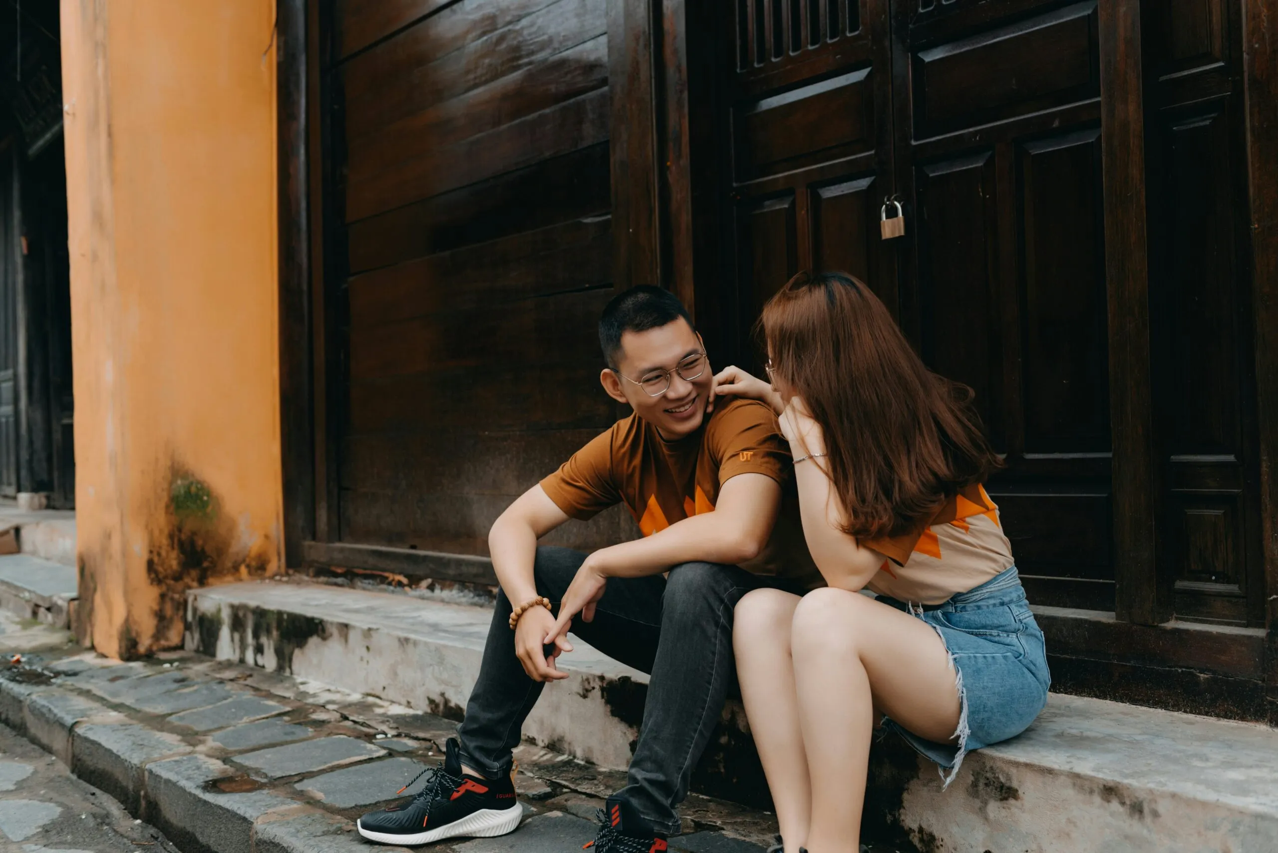 Two people sharing a warm moment representing abundance mindset and genuine connection in relationships