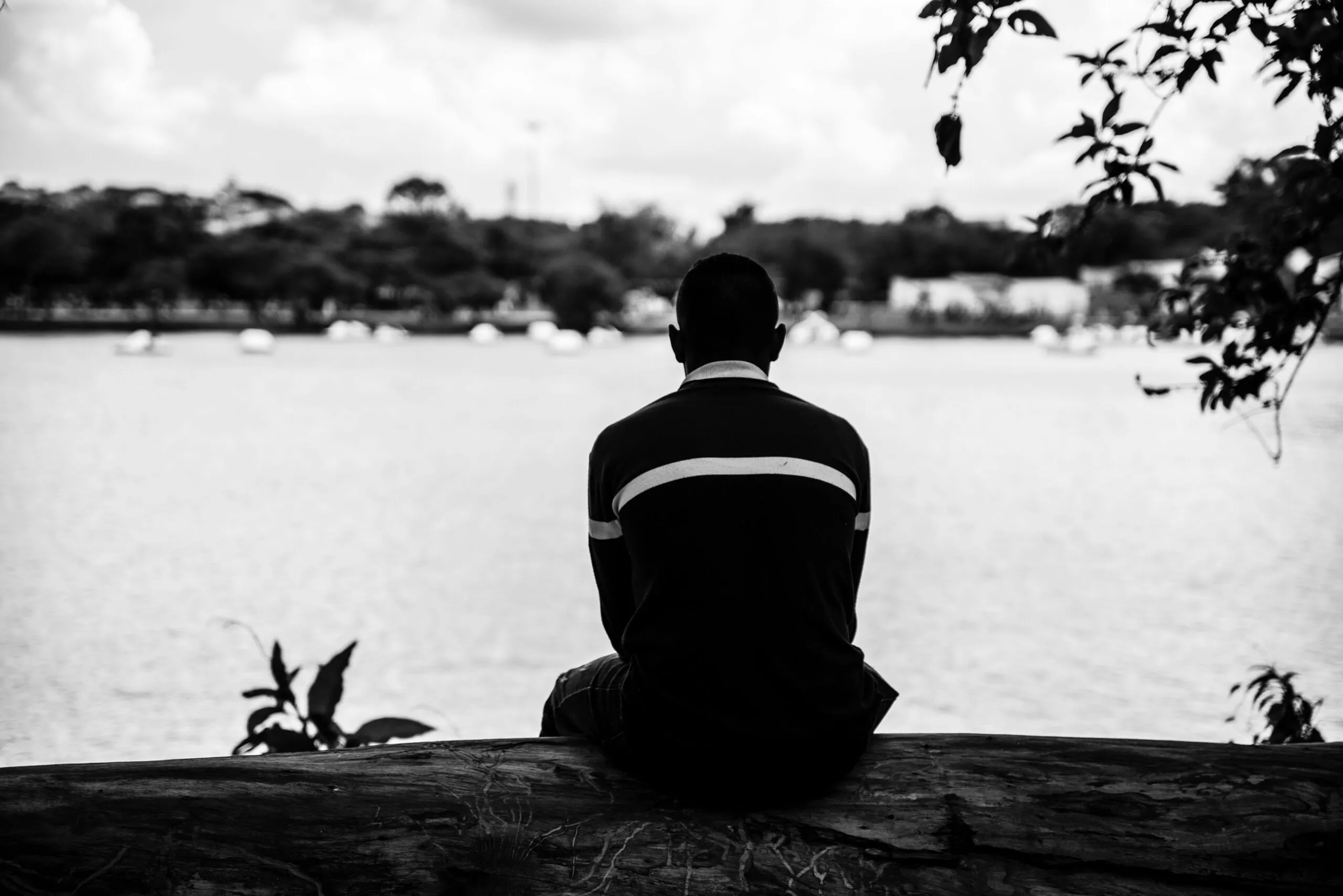 Man sitting in quiet reflection representing emotional curiosity and self-awareness in sexual compulsive behavior recovery