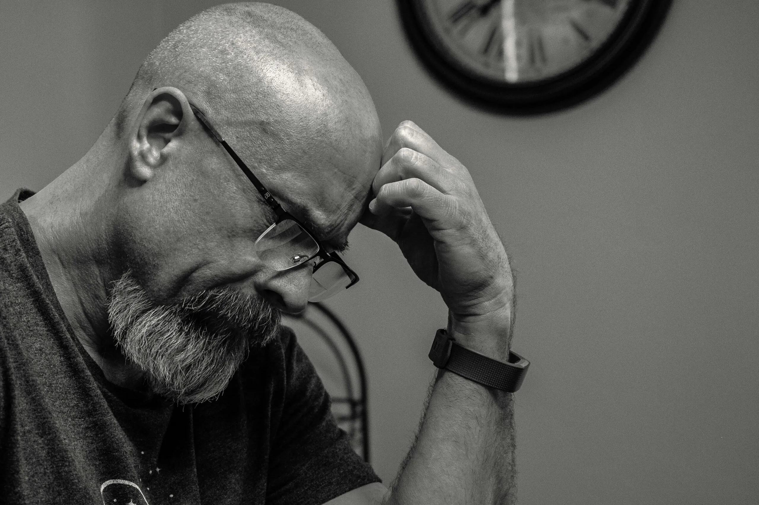 Thoughtful man in reflection representing the inner struggle of scrupulosity and sexual compulsive behavior recovery