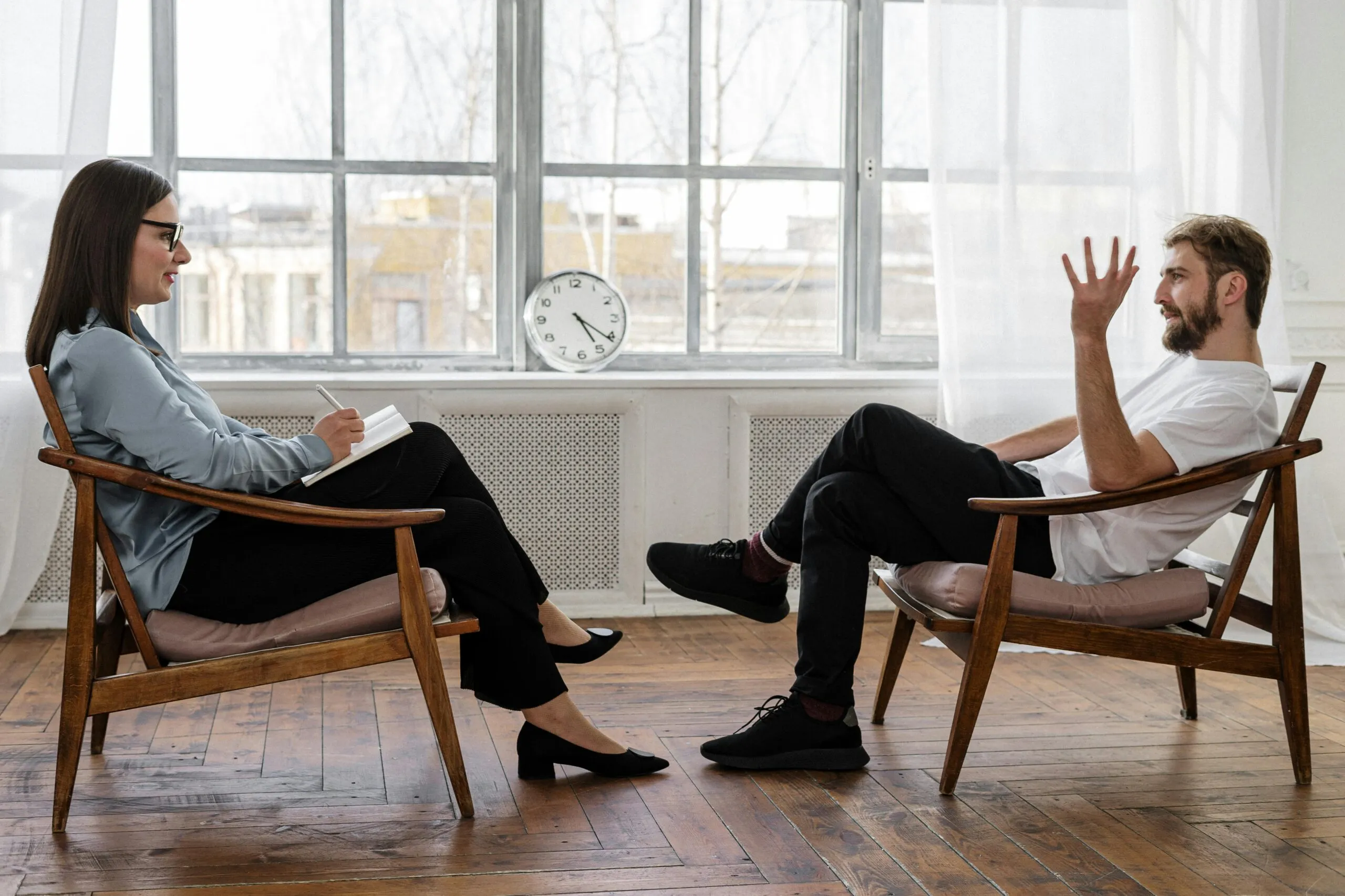 Therapist engaging in a supportive counseling session representing the value of seeing a therapist in Utah