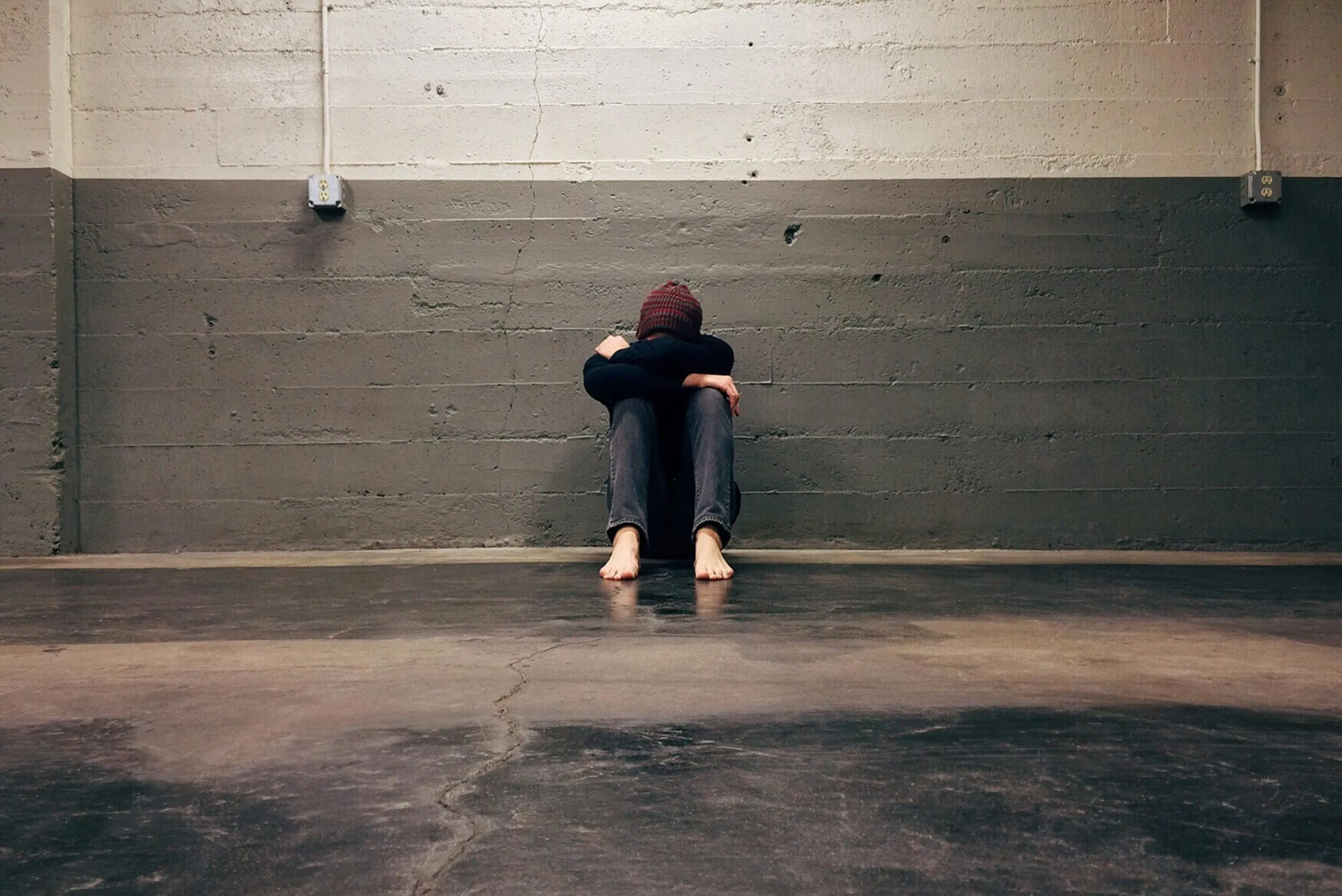 Person sitting alone representing the isolation and guilt experienced with scrupulosity and religious OCD