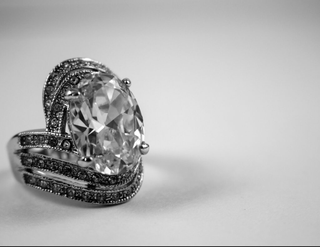 Close-up of a luxurious diamond ring showcasing intricate design and elegance.