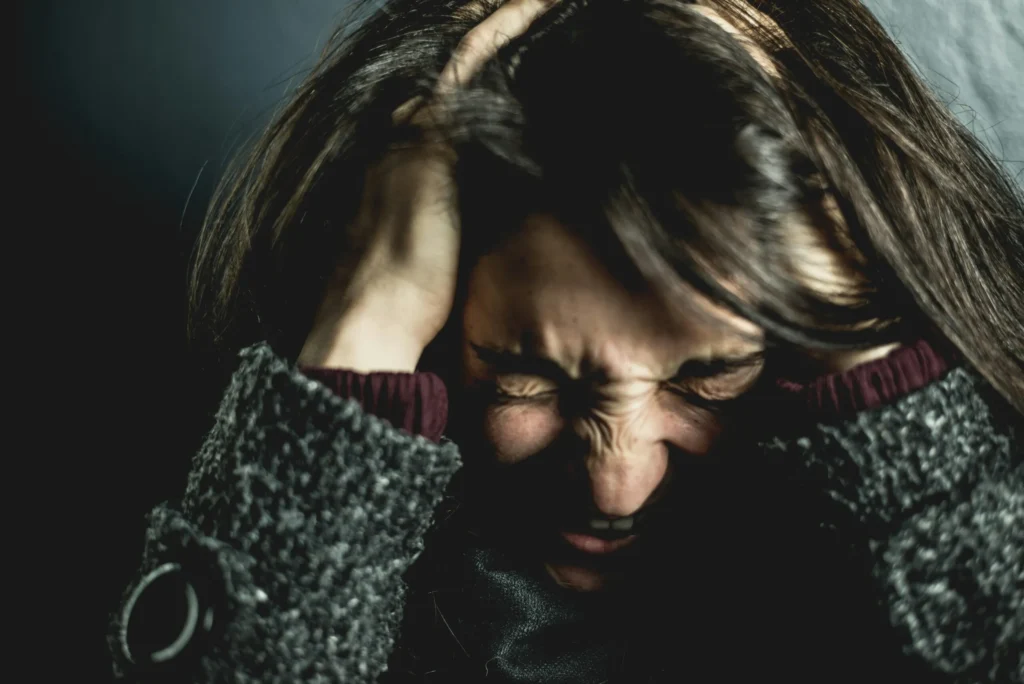 Woman experiencing emotional distress and anxiety after relational betrayal — betrayal trauma therapy Utah