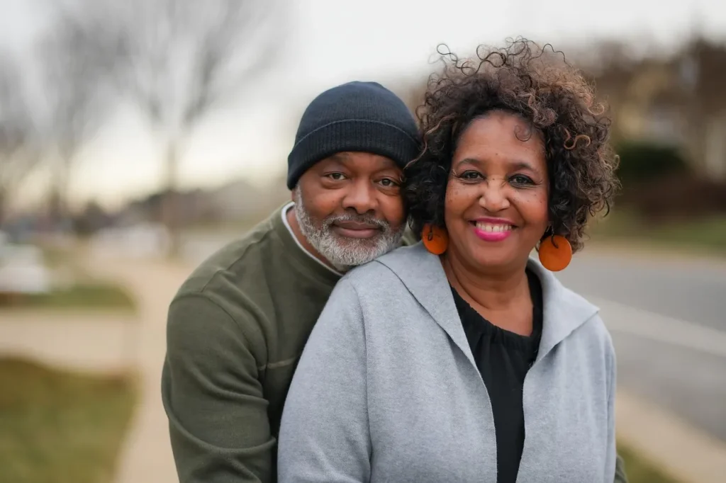 Senior couple smiling together after healing from betrayal trauma with therapy in Utah