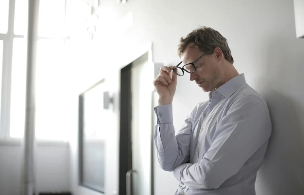 Man reflecting thoughtfully during individual therapy session — trauma-informed counseling Utah