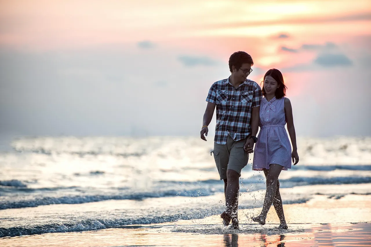 Couple holding hands walking together outdoors after therapy session reflection”
